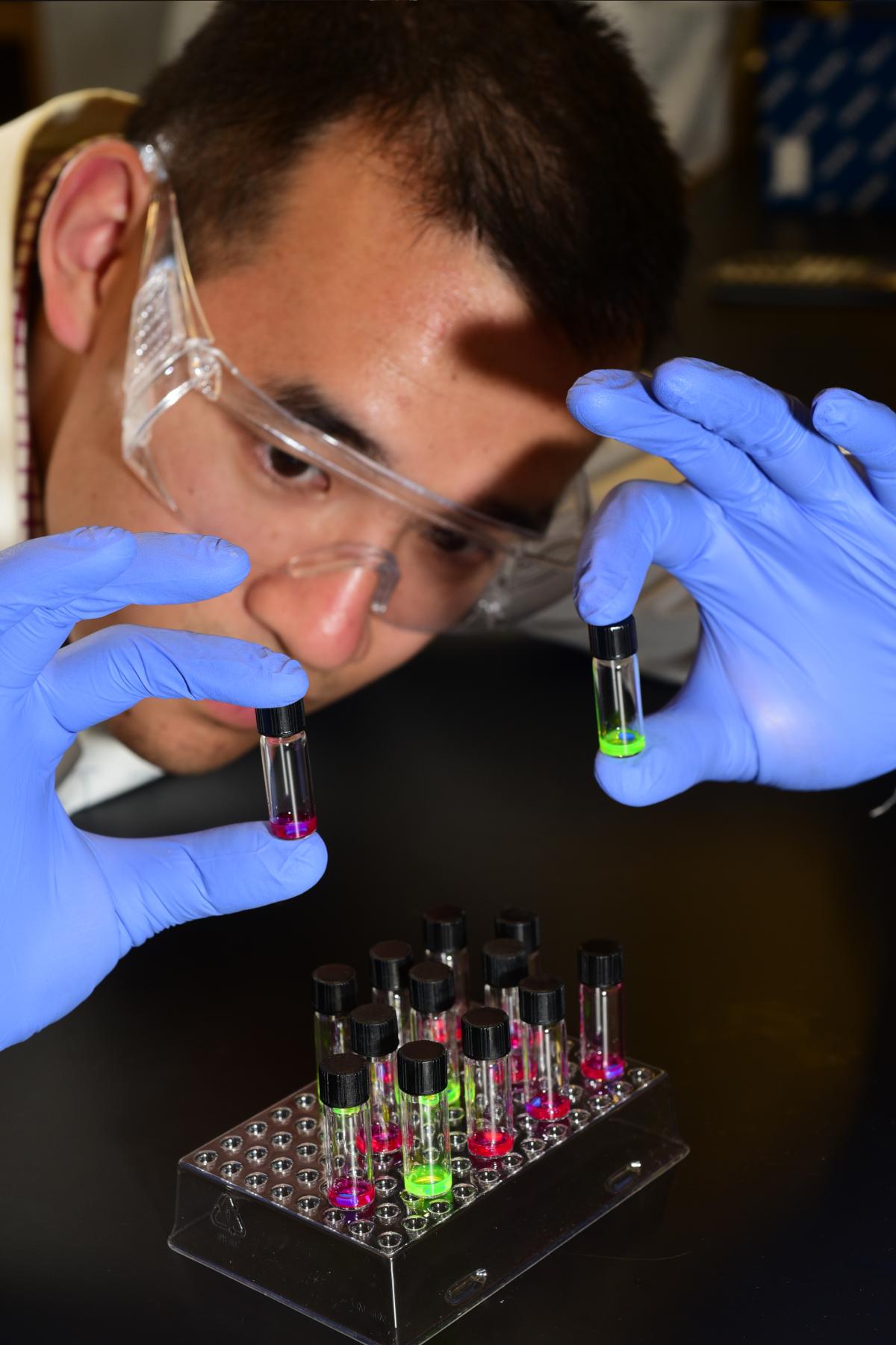 grad student with test tubes