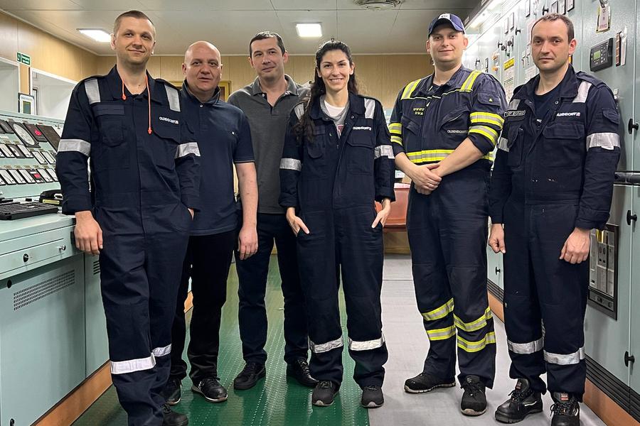 Stathatou (center) onboard the Hedwig Oldendorff vessel with the crew.
